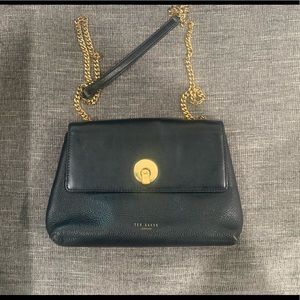 Black Ted Baker Crossbody with gold chain.